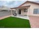 Beautiful backyard featuring a covered patio and artificial turf at 5824 Red Gull St, Las Vegas, NV 89149