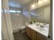Well-lit bathroom with a shower-tub combo and a vanity at 5824 Red Gull St, Las Vegas, NV 89149