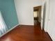 Bedroom with wood floors, neutral walls and a large window at 5824 Red Gull St, Las Vegas, NV 89149
