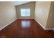 An inviting bedroom with hardwood floors and large windows, perfect for relaxation at 5824 Red Gull St, Las Vegas, NV 89149