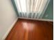 Bright bedroom featuring hardwood floors and a window with sheer curtains at 5824 Red Gull St, Las Vegas, NV 89149