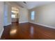 Bedroom with wood floors, a window with blinds, and an ensuite bathroom at 5824 Red Gull St, Las Vegas, NV 89149