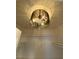 Closet with a fancy chandelier and shelving provides ample storage in style at 5824 Red Gull St, Las Vegas, NV 89149