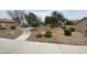Well-maintained front yard featuring manicured bushes and stone landscaping at 5824 Red Gull St, Las Vegas, NV 89149