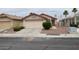 Charming single-story home with a desert-landscaped front yard, concrete driveway, and an attached two-car garage at 5824 Red Gull St, Las Vegas, NV 89149