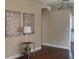 Hallway featuring hardwood floors, decorative artwork, and the entryway to the kitchen at 5824 Red Gull St, Las Vegas, NV 89149