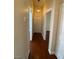 Bright hallway features hardwood floors and neutral walls, with doorways leading to various rooms at 5824 Red Gull St, Las Vegas, NV 89149