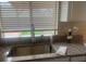 Stainless steel sink and modern faucet with granite countertops near the window at 5824 Red Gull St, Las Vegas, NV 89149
