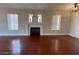 Bright and spacious living room features a fireplace with mantle and natural lighting at 5824 Red Gull St, Las Vegas, NV 89149