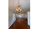 Living room featuring a chandelier, fireplace, and hardwood floors at 5824 Red Gull St, Las Vegas, NV 89149