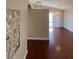 Open-concept living room featuring hardwood floors and a light fixture at 5824 Red Gull St, Las Vegas, NV 89149