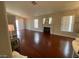 Spacious living room boasts hardwood floors, a fireplace, and plenty of natural light from the windows at 5824 Red Gull St, Las Vegas, NV 89149