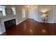 Bright living room featuring a fireplace, hardwood floors, and neutral paint at 5824 Red Gull St, Las Vegas, NV 89149