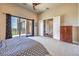 Bedroom with sliding doors to a balcony and a small wardrobe at 583 Saint Croix St, Henderson, NV 89012