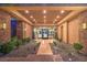 Inviting covered entrance with stone accents, manicured landscaping, and recessed lighting at 583 Saint Croix St, Henderson, NV 89012