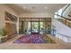 Welcoming foyer with stone floor, statement art, and a staircase at 583 Saint Croix St, Henderson, NV 89012
