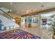 Spacious home foyer featuring stone floors, statement art, and a modern staircase at 583 Saint Croix St, Henderson, NV 89012