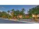 Beautifully landscaped home with manicured shrubs, elegant lighting, and a paved walkway leading to the grand entrance at 583 Saint Croix St, Henderson, NV 89012