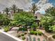 A well-manicured front yard features desert landscaping, complemented by lush trees, and a stone walkway leading to the entrance at 583 Saint Croix St, Henderson, NV 89012