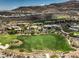 A serene view of a golf course, showcasing the property and its access to the green, lush fairway at 583 Saint Croix St, Henderson, NV 89012