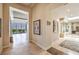 Bright hallway with tile floors, recessed lighting, and artwork on the walls at 583 Saint Croix St, Henderson, NV 89012