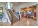 Open hallway that transitions into dining room, featuring stone floors and natural light at 583 Saint Croix St, Henderson, NV 89012