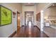 Long hallway features dark wood floors, recessed lighting, and artwork at 583 Saint Croix St, Henderson, NV 89012