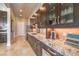 Kitchen features a long countertop with plenty of storage and display cabinets at 583 Saint Croix St, Henderson, NV 89012