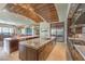 Expansive kitchen featuring dual islands, stainless steel appliances, and views of the backyard at 583 Saint Croix St, Henderson, NV 89012