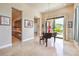 Open living room with a piano, a view of the backyard, and access to the kitchen at 583 Saint Croix St, Henderson, NV 89012