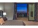 Main bedroom features a patterned bedspread, city views and large sliding glass doors to the outdoor balcony at 583 Saint Croix St, Henderson, NV 89012
