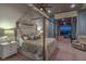 Stunning main bedroom featuring a four-poster bed and access to a private balcony with city views at 583 Saint Croix St, Henderson, NV 89012
