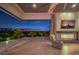 Cozy main bedroom with a fireplace, seating area, and a panoramic view of the city lights at 583 Saint Croix St, Henderson, NV 89012