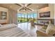 Bright main bedroom featuring a fireplace, sitting area, large windows, and tile floors at 583 Saint Croix St, Henderson, NV 89012