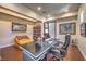 Stylish home office featuring a comfortable seating area and built-in bookshelves at 583 Saint Croix St, Henderson, NV 89012