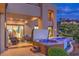 Relaxing outdoor space with a hot tub, comfortable seating, and a lush landscape at 583 Saint Croix St, Henderson, NV 89012