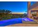 Luxury pool area featuring an infinity pool and spa overlooking the Las Vegas skyline at 583 Saint Croix St, Henderson, NV 89012