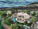 Luxury two-story home featuring a private pool, covered patio, and meticulously landscaped backyard overlooking the golf course at 583 Saint Croix St, Henderson, NV 89012