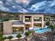 Stunning modern home with a private pool, spacious patio, and floor-to-ceiling windows offering panoramic views of the landscape at 583 Saint Croix St, Henderson, NV 89012