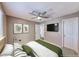 Comfortable bedroom offering ample natural light, ceiling fan, and easy access to an ensuite bathroom at 601 Cabrillo Cir # 536, Henderson, NV 89015