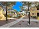 Picturesque community with lush landscaping, walkways, and buildings with warm-toned exteriors at 601 Cabrillo Cir # 536, Henderson, NV 89015