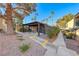 Outdoor picnic area with BBQ, surrounded by mature trees and manicured landscaping at 601 Cabrillo Cir # 536, Henderson, NV 89015