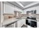 Updated kitchen featuring stainless steel appliances and white cabinets at 601 Cabrillo Cir # 536, Henderson, NV 89015