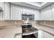 Close up of kitchen features stainless steel stove and microwave at 601 Cabrillo Cir # 536, Henderson, NV 89015