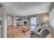 Spacious living area with fireplace, wood floors, and large windows, offering comfort and style at 601 Cabrillo Cir # 536, Henderson, NV 89015