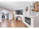 Modern living room with a fireplace and seamless flow into the adjacent kitchen at 601 Cabrillo Cir # 536, Henderson, NV 89015