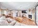 Inviting living room with fireplace, wood floors, and open floor plan, ideal for modern living and entertaining at 601 Cabrillo Cir # 536, Henderson, NV 89015