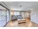 Open-concept living area featuring wood-style flooring and comfortable seating arrangement at 601 Cabrillo Cir # 536, Henderson, NV 89015