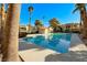 Beautiful swimming pool with surrounding palm trees and well-maintained buildings in the background at 601 Cabrillo Cir # 536, Henderson, NV 89015