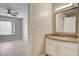 Bathroom featuring granite counters and a mirror, with bedroom view at 7300 Pirates Cove Rd # 1032, Las Vegas, NV 89145
